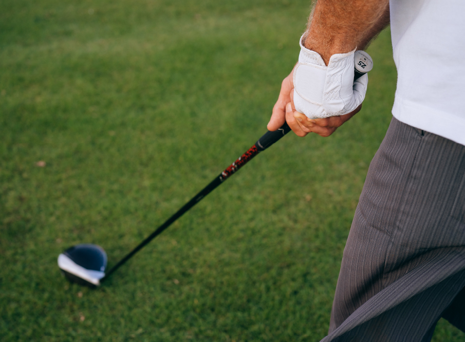 Golfer teeing up